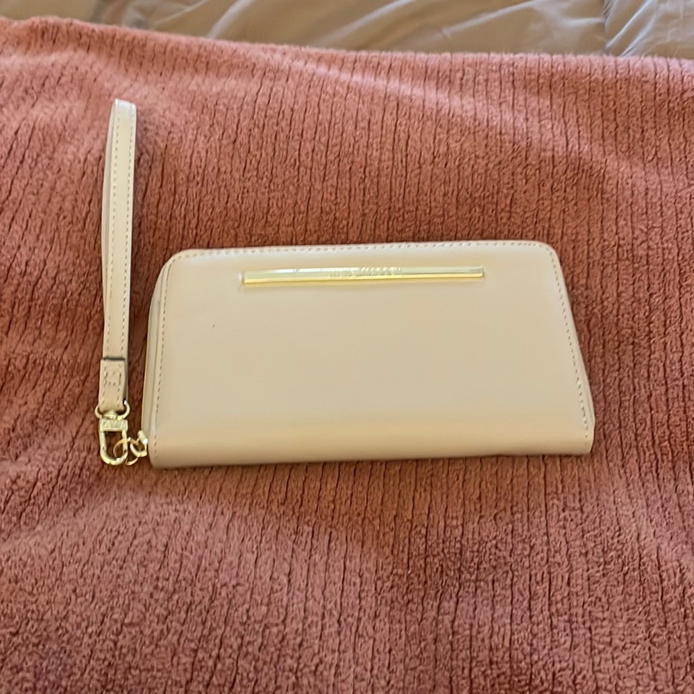 Brand new -  no tags. Steve Madden Wristlet Wallet. Ivory. Fits everything!
